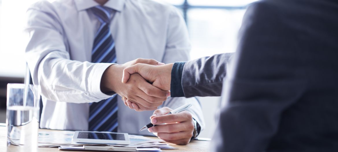 Business handshake in the office