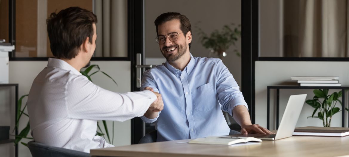 Employer, boss hiring candidate after successful job interview. Happy customer and lawyer, finishing consultation, meeting, shaking hands. Happy business men giving handshakes after negotiations