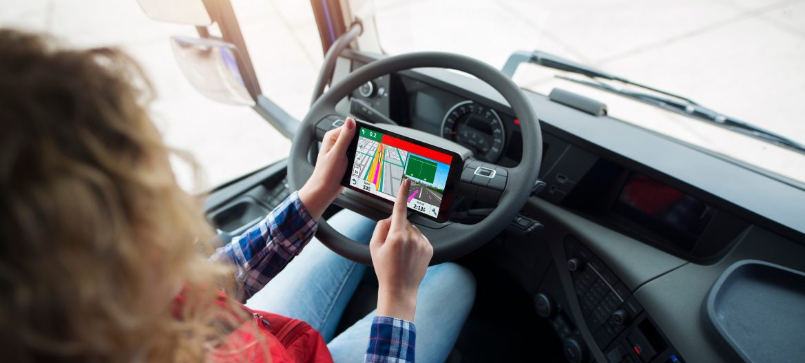 Shot of an unrecognizable truck driver using global positioning system GPS navigation for destination. Fingers choosing route navigation. Transportation services.
