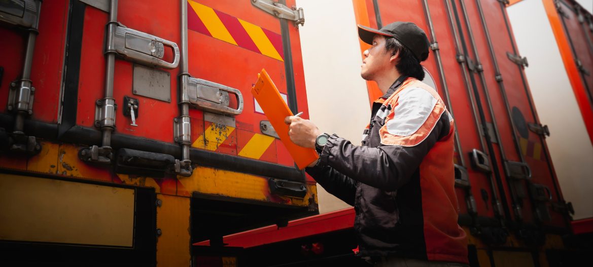 Truck Driver is Checking Container Door. Security of Cargo Shipping. Semi Truck Maintenance. Inspection Safety Before Driving. Freight Truck Logistics Transport.